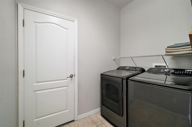 5116 Tempic Dr, Mount Dora, FL 32757 - laundry area with washing machine and clothes dryer and light tile patterned floors