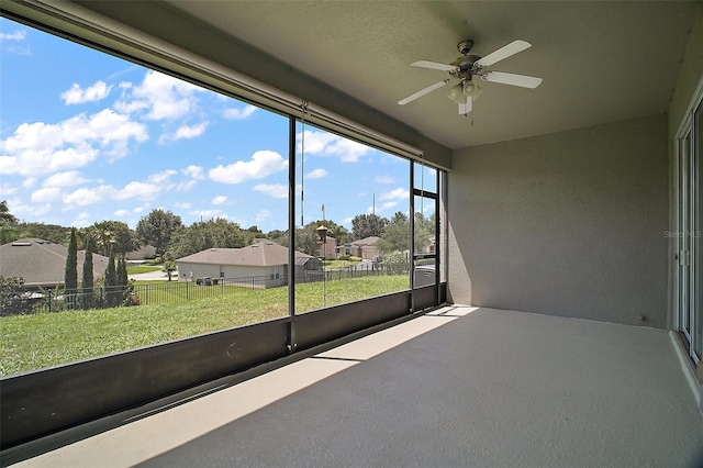 5116 Tempic Dr, Mount Dora, FL 32757 - unfurnished sunroom with a ceiling fan and a residential view
