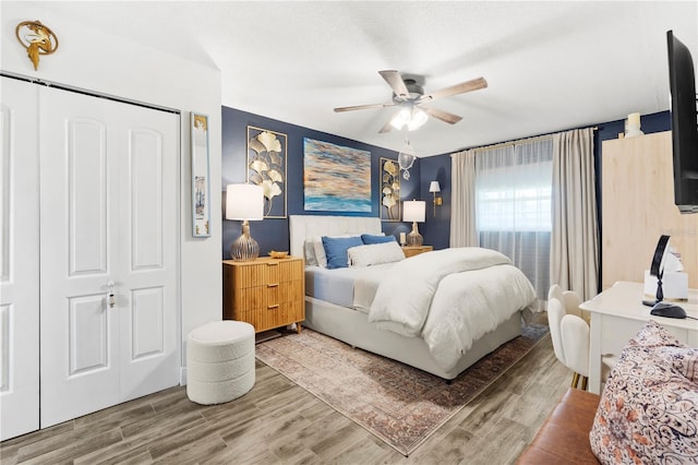 1100 E Caroline St Unit 204, Tavares, FL 32778 - bedroom featuring wood finished floors, ceiling fan, and a closet