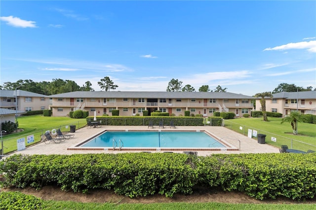 1100 E Caroline St Unit 204, Tavares, FL 32778 - community pool featuring a residential view and a patio area