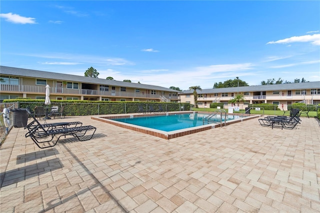 1100 E Caroline St Unit 204, Tavares, FL 32778 - community pool featuring a residential view and a patio area