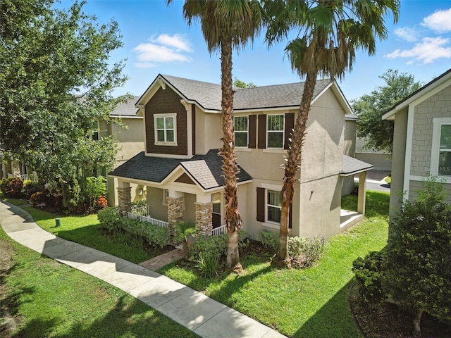 1110 Pine Falls Ln, Ocoee, FL 34761 - traditional-style home featuring stucco siding, a front lawn, roof with shingles, and a porch
