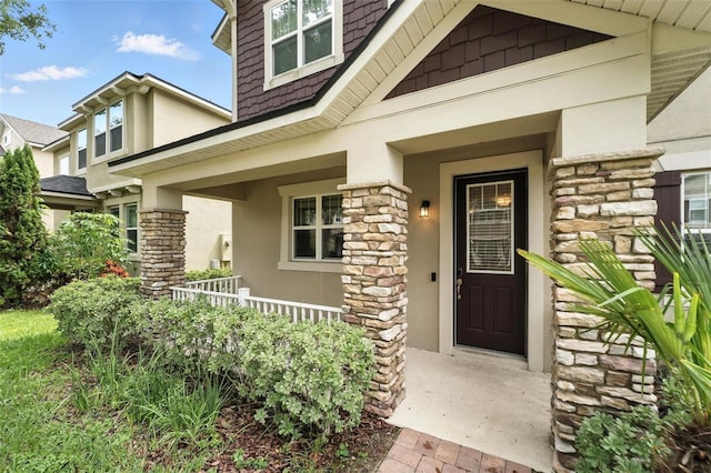 1110 Pine Falls Ln, Ocoee, FL 34761 - entrance to property featuring stucco siding, stone siding, and a porch
