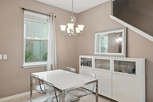 1110 Pine Falls Ln, Ocoee, FL 34761 - dining area with a chandelier and baseboards
