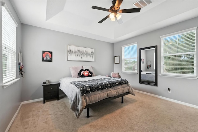 1110 Pine Falls Ln, Ocoee, FL 34761 - bedroom with a tray ceiling, carpet, and ceiling fan