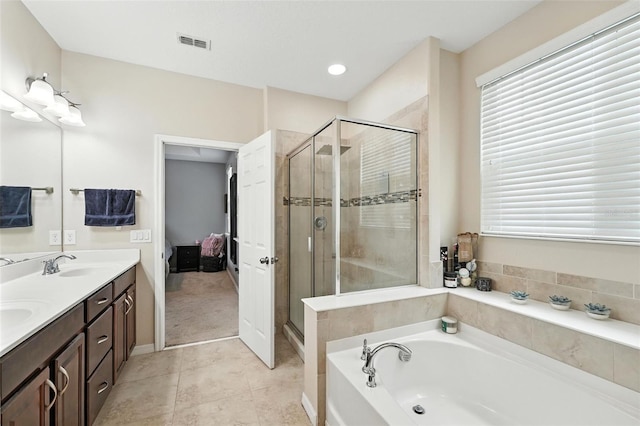 1110 Pine Falls Ln, Ocoee, FL 34761 - ensuite bathroom featuring a garden tub, double vanity, a shower stall, tile patterned floors, and recessed lighting