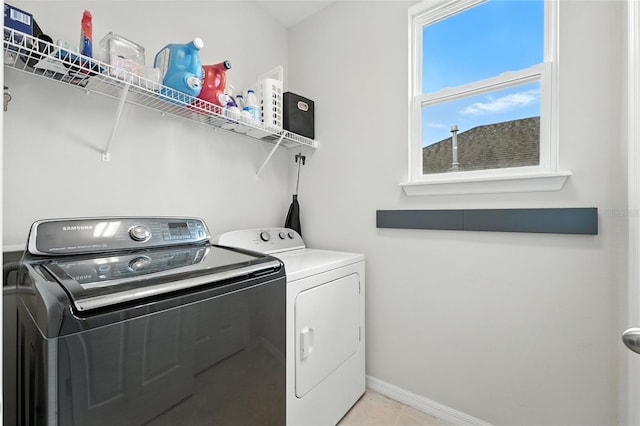 1110 Pine Falls Ln, Ocoee, FL 34761 - laundry room with washer and dryer and light tile patterned floors