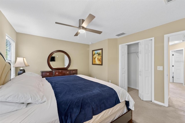 4558 Baleno Ln, Kissimmee, FL 34746 - bedroom featuring light carpet, a closet, and ceiling fan