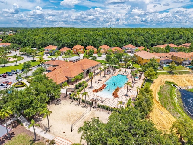 4558 Baleno Ln, Kissimmee, FL 34746 - aerial view of residential area featuring a pool area and a heavily wooded area