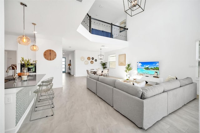 9175 Sommerset Hills Dr, Davenport, FL 33896 - living area with a chandelier and a high ceiling