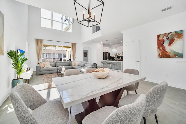 9175 Sommerset Hills Dr, Davenport, FL 33896 - dining room with a chandelier and a high ceiling