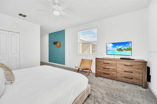 9175 Sommerset Hills Dr, Davenport, FL 33896 - bedroom with light carpet, a ceiling fan, and a closet