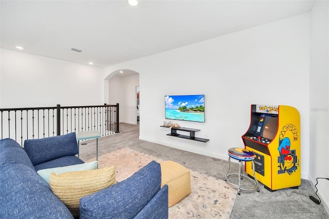 9175 Sommerset Hills Dr, Davenport, FL 33896 - living room featuring carpet, arched walkways, and recessed lighting