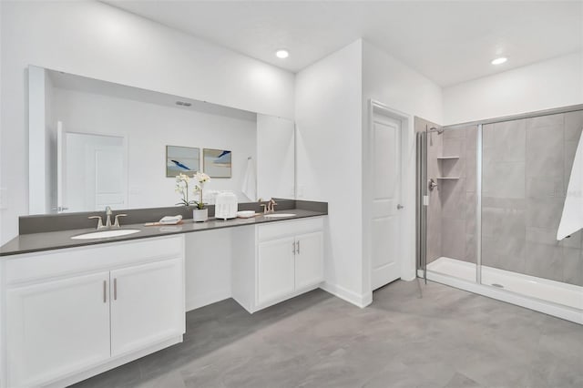 9175 Sommerset Hills Dr, Davenport, FL 33896 - bathroom with double vanity, a stall shower, finished concrete floors, and recessed lighting