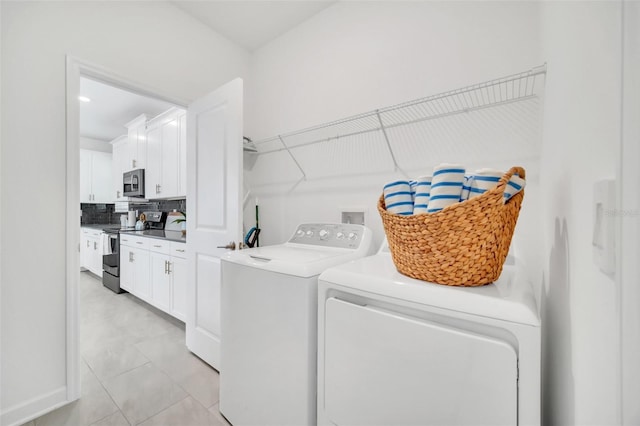 9175 Sommerset Hills Dr, Davenport, FL 33896 - laundry area featuring washing machine and clothes dryer and light tile patterned floors