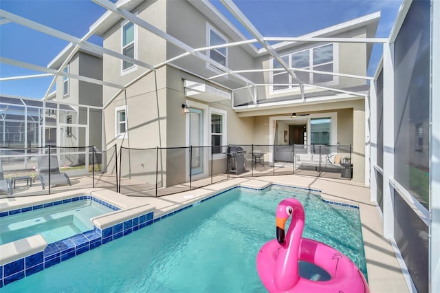 9175 Sommerset Hills Dr, Davenport, FL 33896 - back of property with stucco siding, a patio area, a lanai, and a pool with connected hot tub