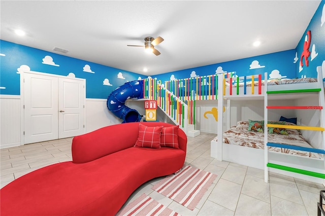 2907 Fable St, Kissimmee, FL 34746 - bedroom featuring wainscoting and a ceiling fan