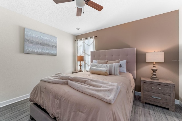 2907 Fable St, Kissimmee, FL 34746 - bedroom featuring wood finished floors, a ceiling fan, and a textured ceiling