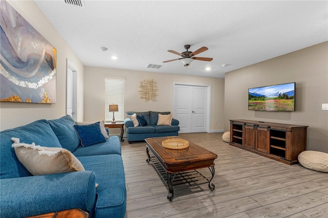 2907 Fable St, Kissimmee, FL 34746 - living area with ceiling fan, light wood-type flooring, recessed lighting, and a textured ceiling