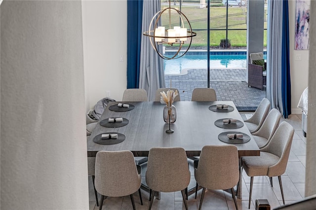 2907 Fable St, Kissimmee, FL 34746 - dining area with healthy amount of natural light, tile patterned flooring, and a chandelier