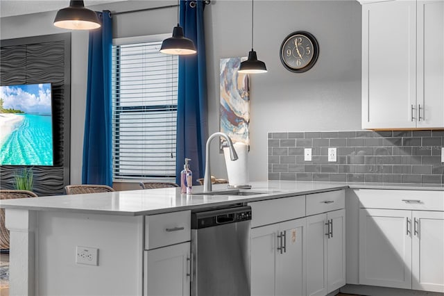 2907 Fable St, Kissimmee, FL 34746 - kitchen featuring dishwasher, decorative backsplash, light countertops, pendant lighting, and white cabinets