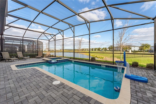 2907 Fable St, Kissimmee, FL 34746 - view of swimming pool featuring a patio, a water view, a pool with connected hot tub, and glass enclosure