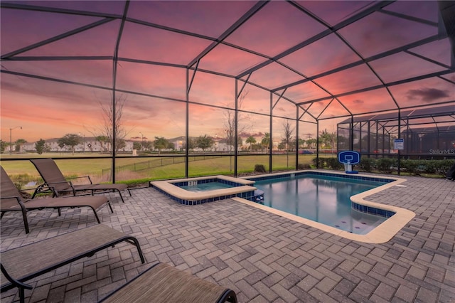 2907 Fable St, Kissimmee, FL 34746 - view of swimming pool featuring a patio, a pool with connected hot tub, and glass enclosure