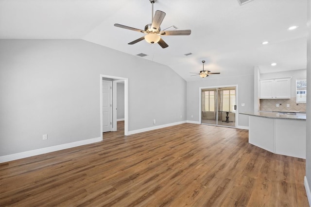 449 Timmonsville Way, The Villages, FL 32162 - unfurnished living room featuring lofted ceiling, ceiling fan, wood finished floors, and recessed lighting