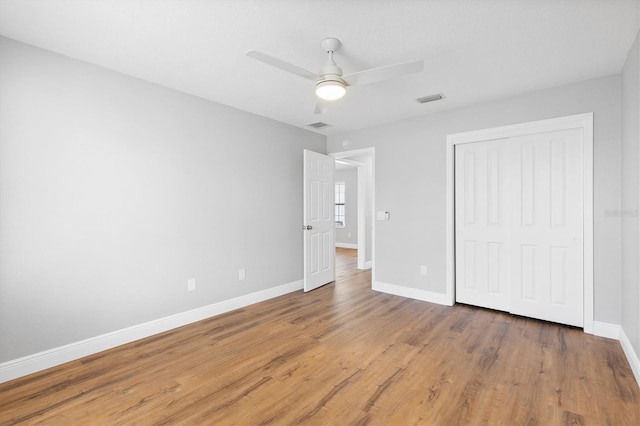 449 Timmonsville Way, The Villages, FL 32162 - unfurnished bedroom featuring a closet, wood finished floors, and a ceiling fan