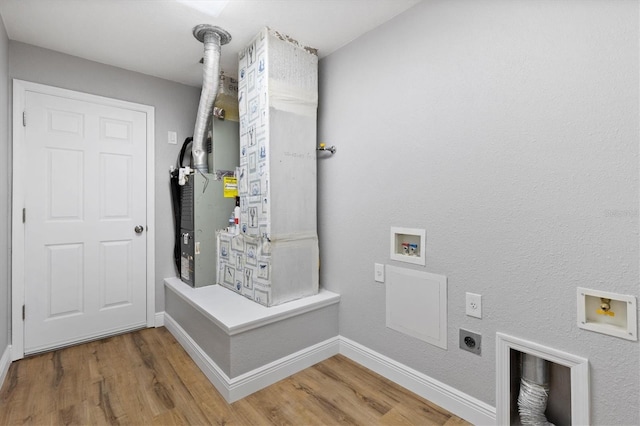 449 Timmonsville Way, The Villages, FL 32162 - washroom featuring washer hookup, electric dryer hookup, and light wood-style floors