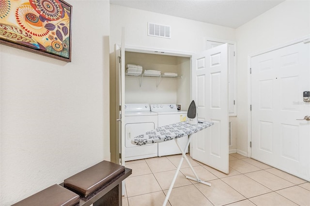 4114 Breakview Dr Unit 110, Orlando, FL 32819 - laundry area with separate washer and dryer and light tile patterned floors