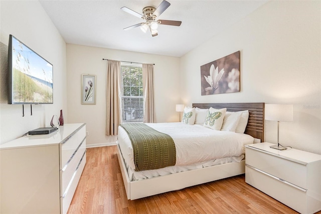 4114 Breakview Dr Unit 110, Orlando, FL 32819 - bedroom with light wood finished floors and ceiling fan