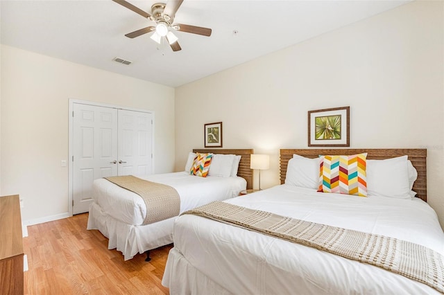 4114 Breakview Dr Unit 110, Orlando, FL 32819 - bedroom featuring light wood-type flooring, a closet, and ceiling fan