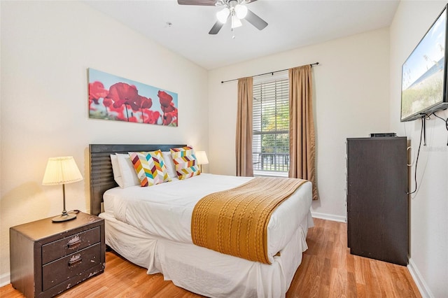 4114 Breakview Dr Unit 110, Orlando, FL 32819 - bedroom with light wood-style floors and a ceiling fan
