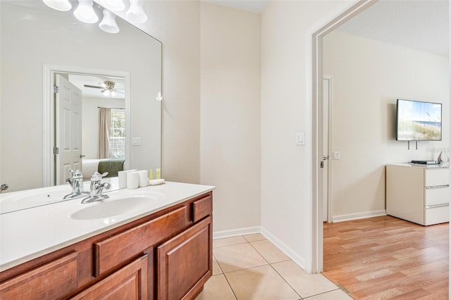 4114 Breakview Dr Unit 110, Orlando, FL 32819 - bathroom with vanity, tile patterned floors, and ceiling fan