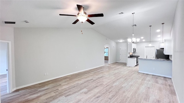 4413 Grass Ave, Sebring, FL 33875 - unfurnished living room featuring ceiling fan, light wood-style floors, a chandelier, vaulted ceiling, and recessed lighting