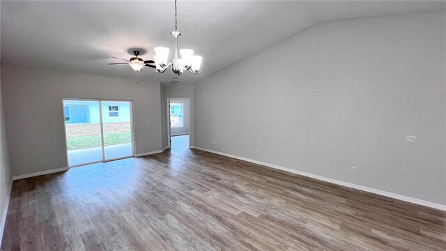 4413 Grass Ave, Sebring, FL 33875 - unfurnished room featuring a chandelier, wood finished floors, vaulted ceiling, and a ceiling fan