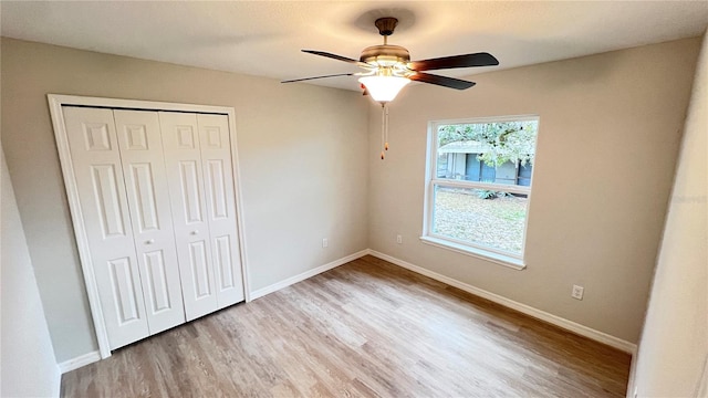 4413 Grass Ave, Sebring, FL 33875 - unfurnished bedroom with wood finished floors, a closet, and ceiling fan