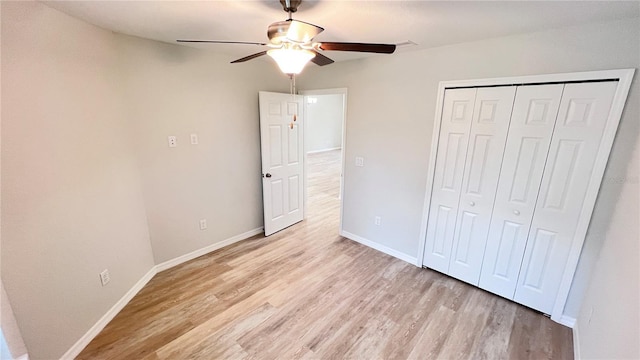 4413 Grass Ave, Sebring, FL 33875 - unfurnished bedroom featuring light wood-style flooring, a closet, and a ceiling fan