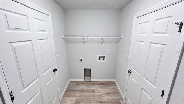 4413 Grass Ave, Sebring, FL 33875 - washroom with electric dryer hookup, light wood-type flooring, and hookup for a washing machine