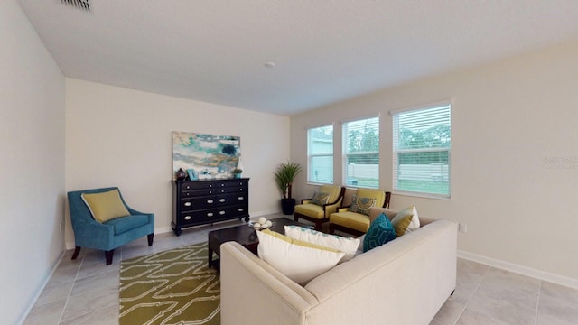 2907 Haze Rd, Clermont, FL 34714 - living room with light tile patterned floors and baseboards