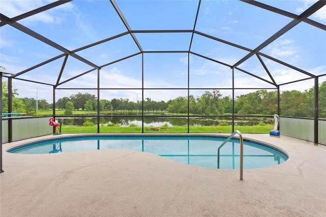 162 Canary Island Cir, Davenport, FL 33837 - outdoor pool featuring a water view, a patio area, view of wooded area, and a lanai