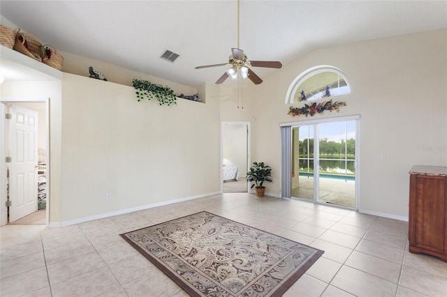 162 Canary Island Cir, Davenport, FL 33837 - empty room with a ceiling fan, light tile patterned flooring, and high vaulted ceiling