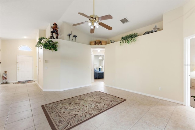 162 Canary Island Cir, Davenport, FL 33837 - spare room with ceiling fan, light tile patterned floors, and vaulted ceiling