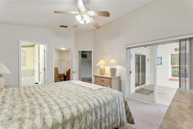 162 Canary Island Cir, Davenport, FL 33837 - carpeted bedroom featuring access to outside, lofted ceiling, a spacious closet, ceiling fan, and ensuite bathroom