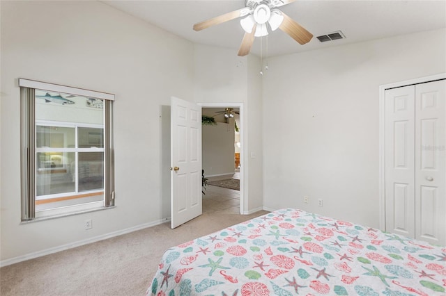 162 Canary Island Cir, Davenport, FL 33837 - bedroom with light carpet, a closet, and ceiling fan