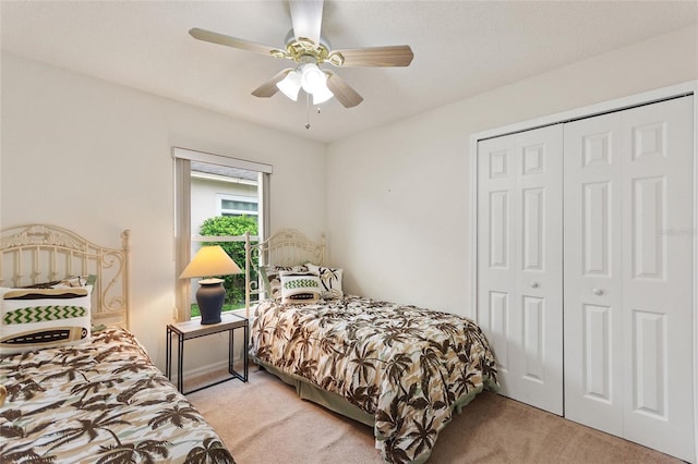 162 Canary Island Cir, Davenport, FL 33837 - bedroom with light carpet, a closet, and a ceiling fan