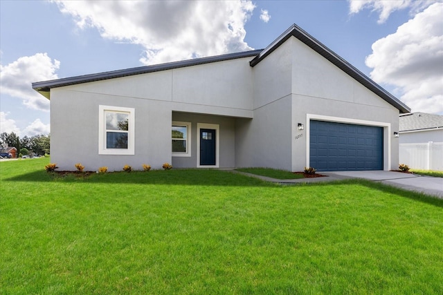16057 SW 17th Ave, Ocala, FL 34473 - view of front facade with driveway, a front lawn, a garage, and stucco siding