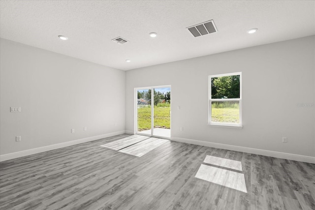 16057 SW 17th Ave, Ocala, FL 34473 - empty room featuring wood finished floors and recessed lighting