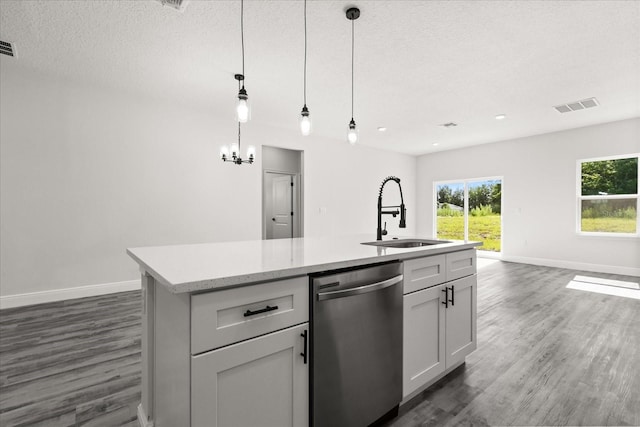 16057 SW 17th Ave, Ocala, FL 34473 - kitchen featuring dishwasher, dark wood-style flooring, open floor plan, a kitchen island with sink, and healthy amount of natural light